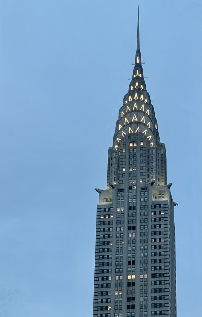 The Chrysler Building in New York City lit up at dusk